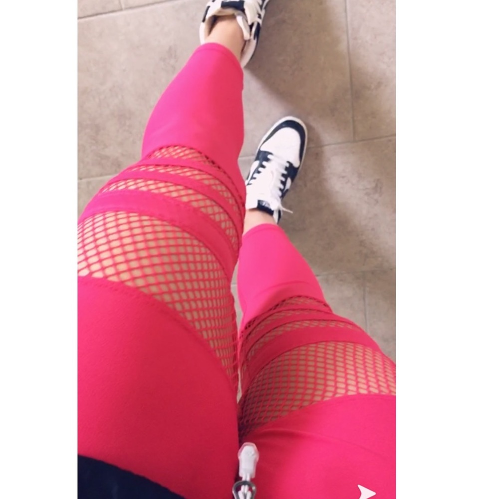 Neon pink fishnet leggings